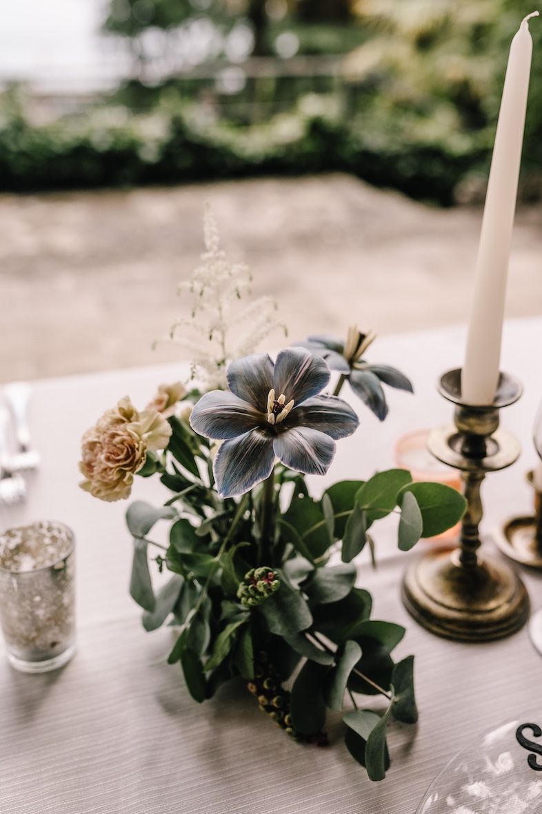 Details of long wedding dinner table overlooking Lake Iseo