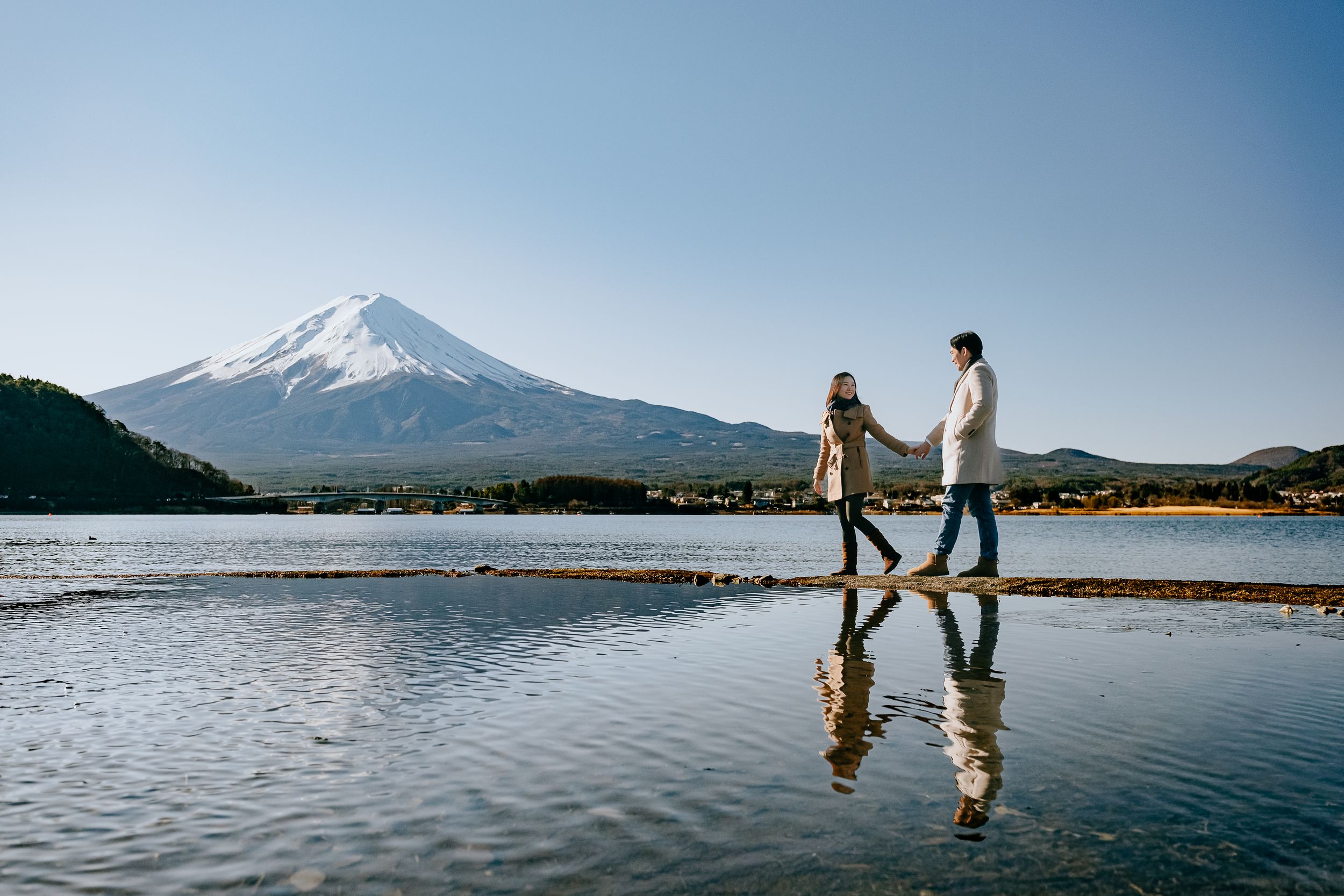 Scenic mountain landscape with lake reflections at Mount Fuji in Japan during a tranquil sunset.