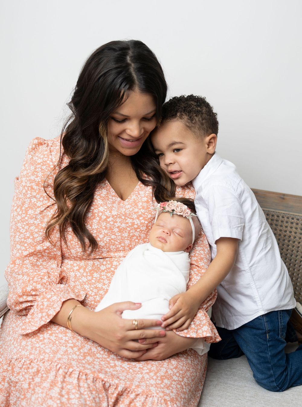 A tender family moment captured in a series of lifestyle photos showing a mother and children in soft, warm lighting.
