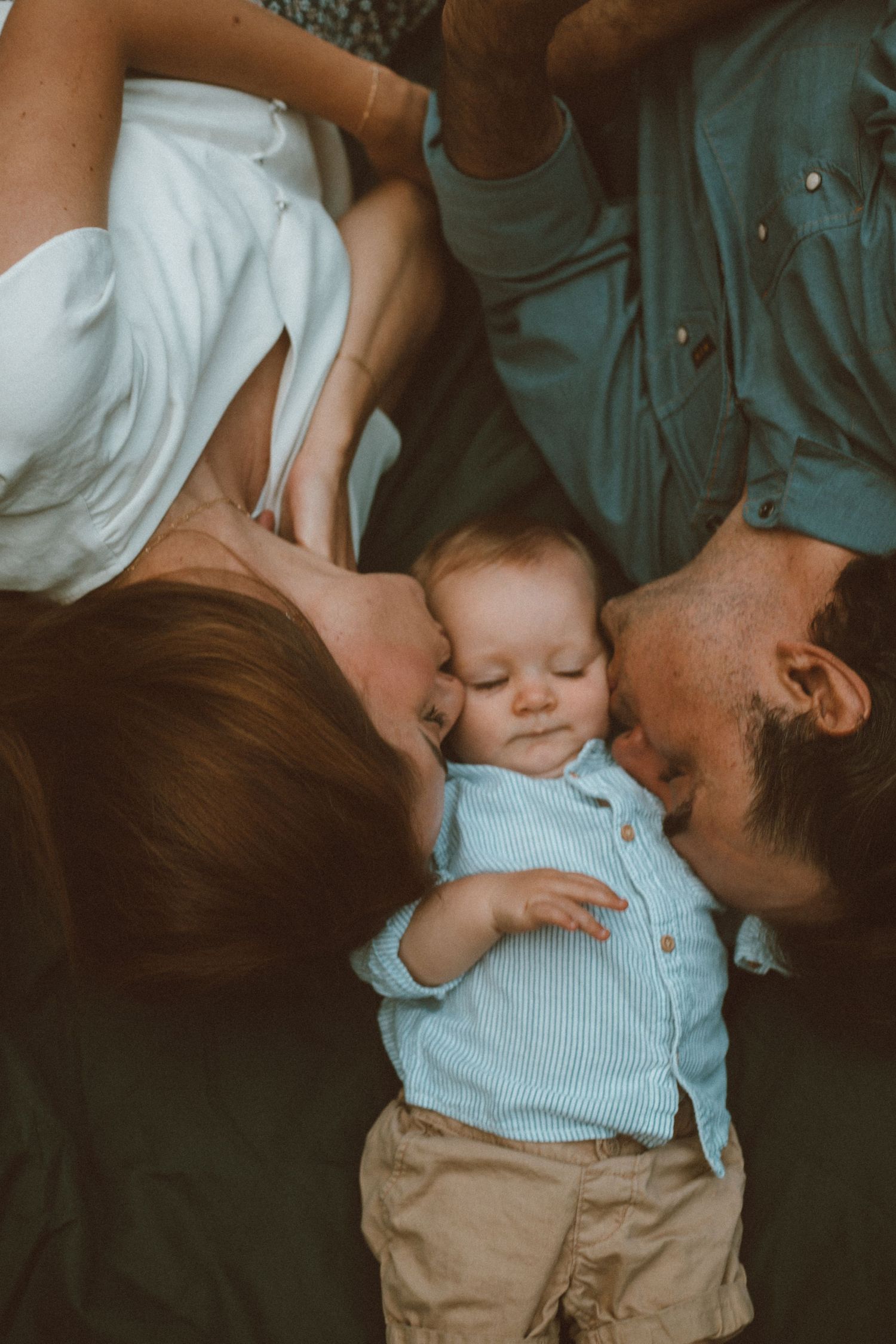 An intimate family portrait showing loving embraces and tender moments.