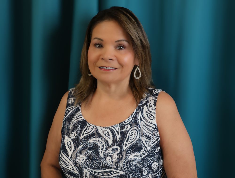 Studio headshots with blue backdrop showing professional portraits in business attire.