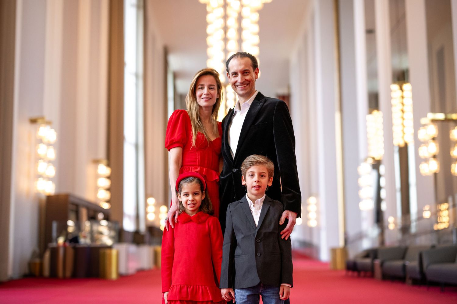 Candid moment of a family laughing together during their photo session at the Kennedy Center.
