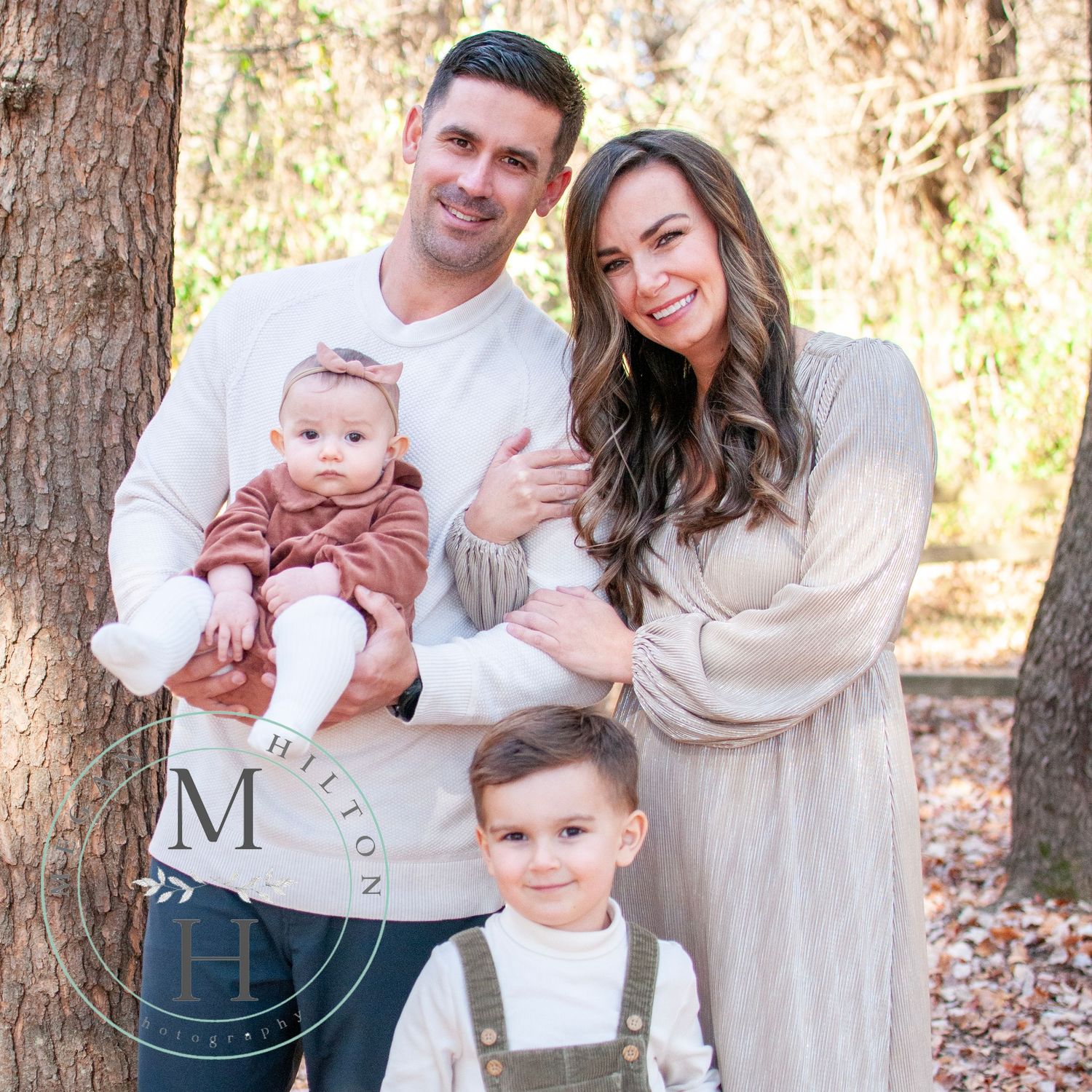Family standing pose outdoor nature setting
