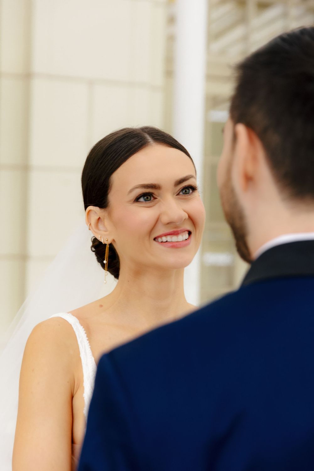 Candid moment between bride and groom on their wedding day.