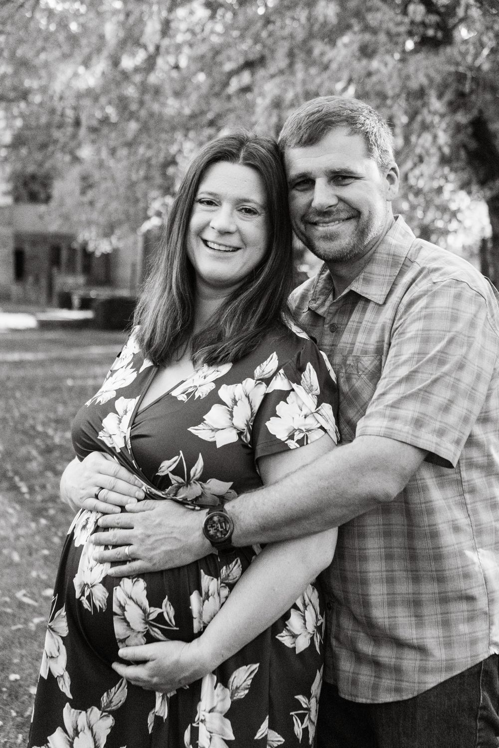 Black and white portrait series showing intimate moments between couple outdoors.