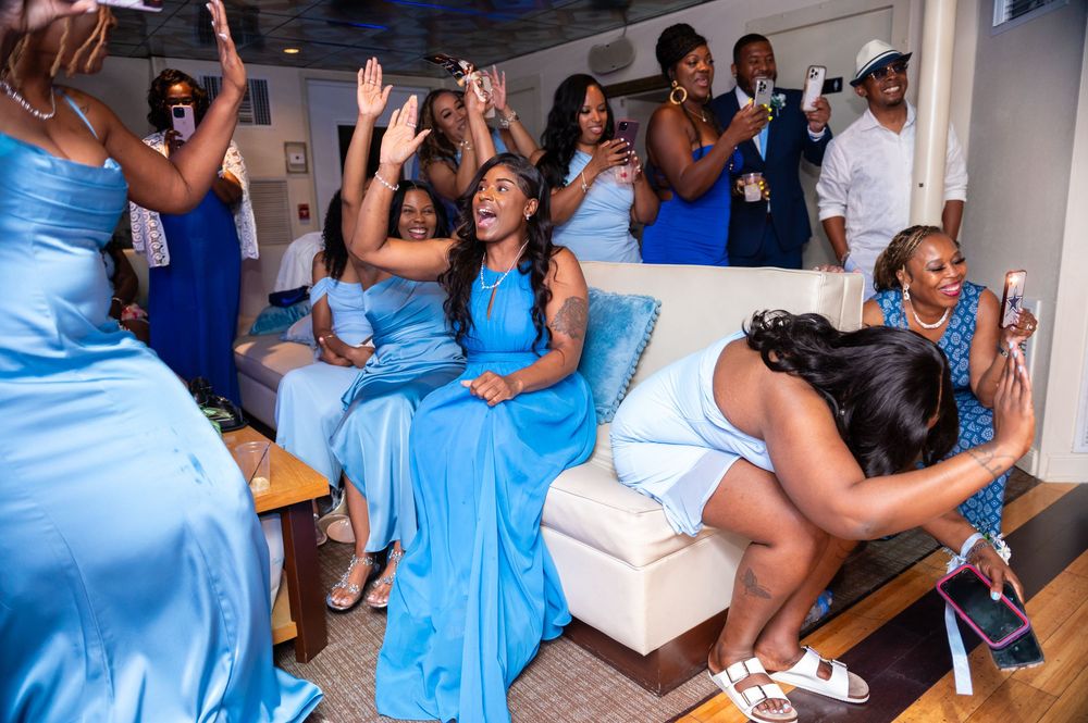 Entertainment setup on yacht deck with guests and live musician