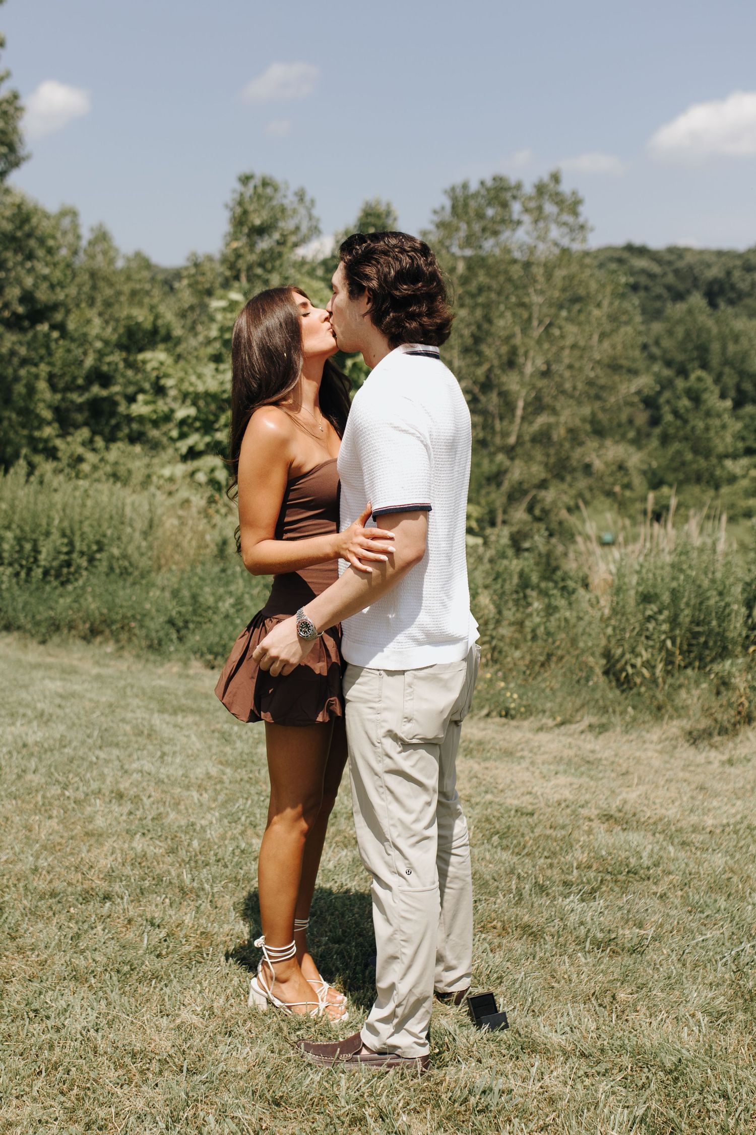 Brooke and Martin kissing after their proposal in Central Ohio Metro Park.