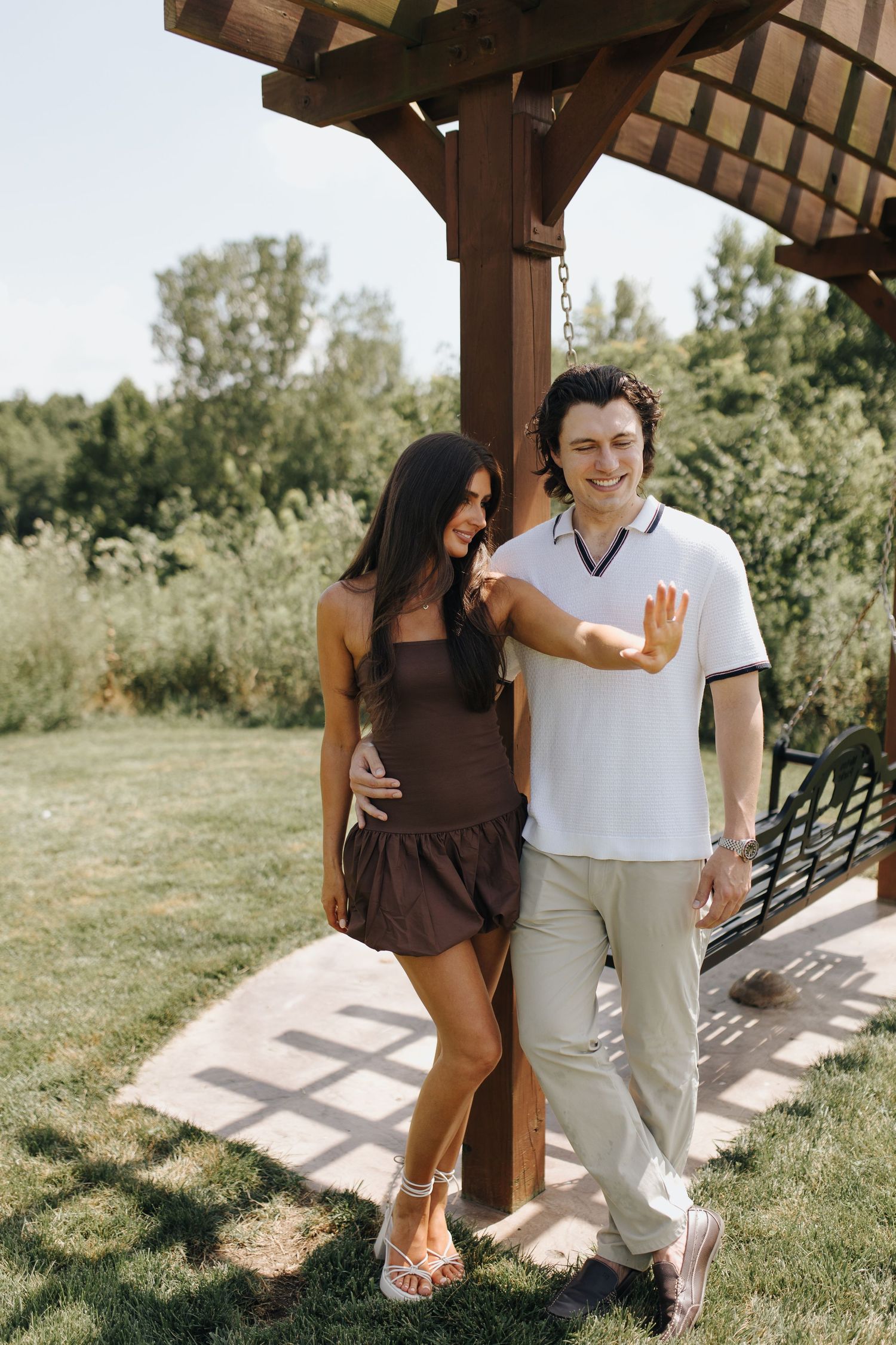 Newly engaged couple admiring engagement ring at River Bluff in High Banks Metro Park, Columbus, Ohio.