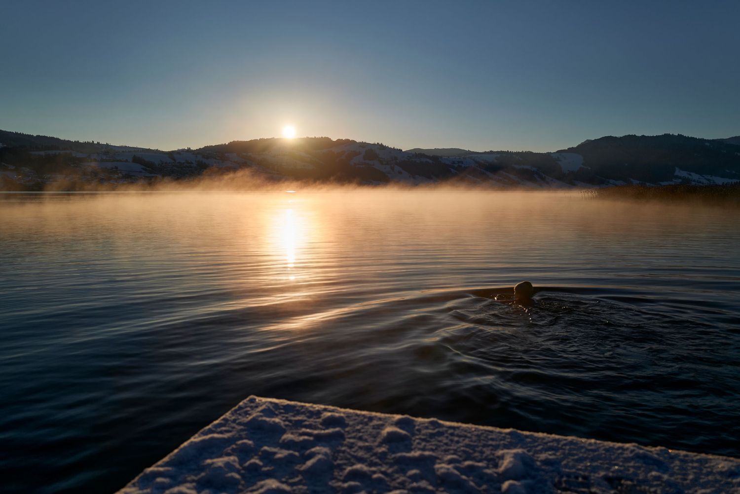 Landscape photography, cold-water swimmer. Location: Unteraegeri, CH. Photo by Dayle Prowse.