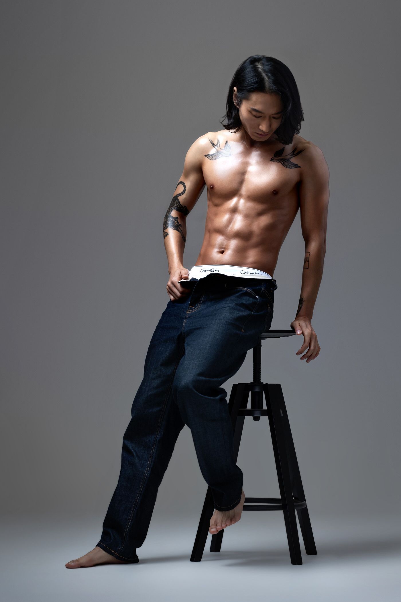 Artistic figure photography series showing a dancer with flowing white fabric against a dark background.
