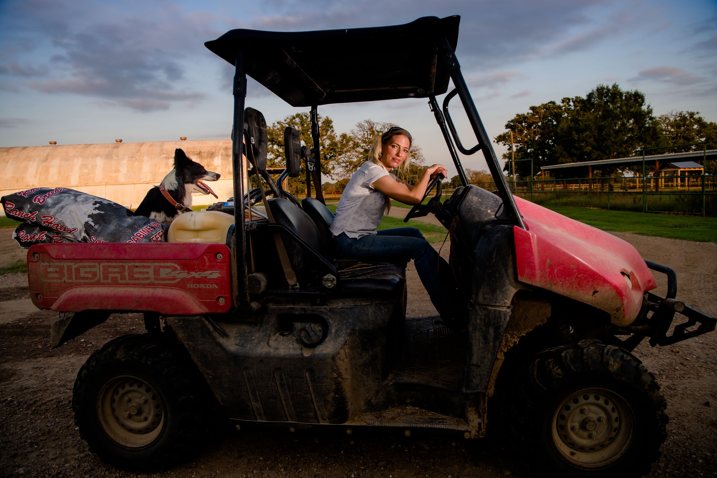 A series of silhouetted golf carts against dramatic sunset skies on a golf course.