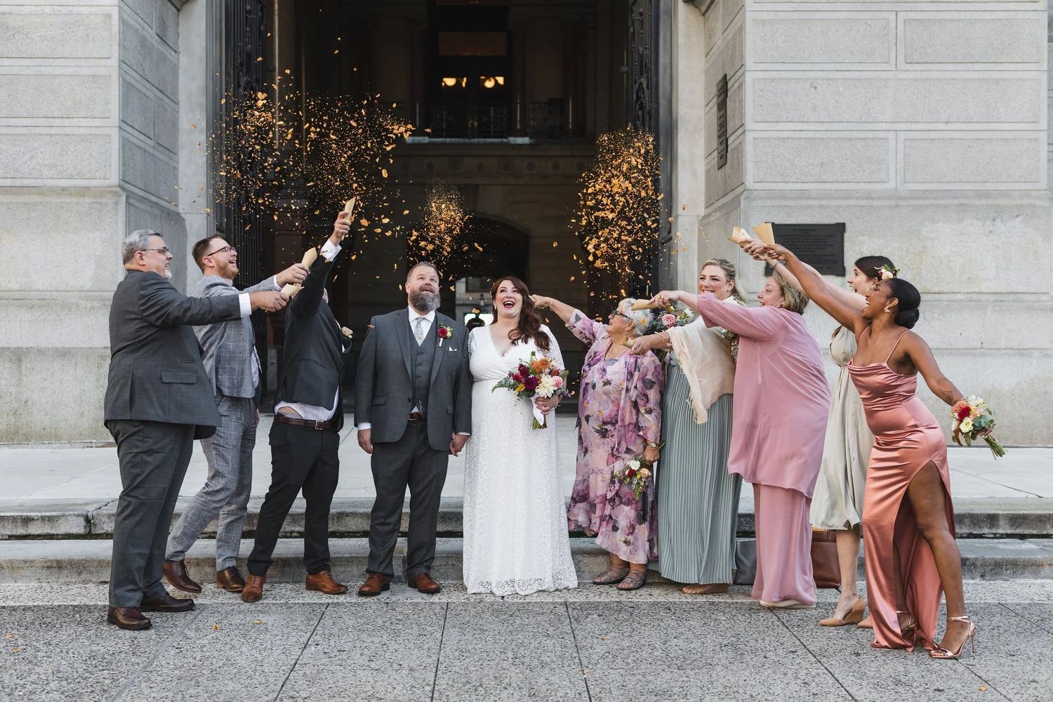 Intimate elopement wedding celebration outside of Philadelphia's City Hall. \