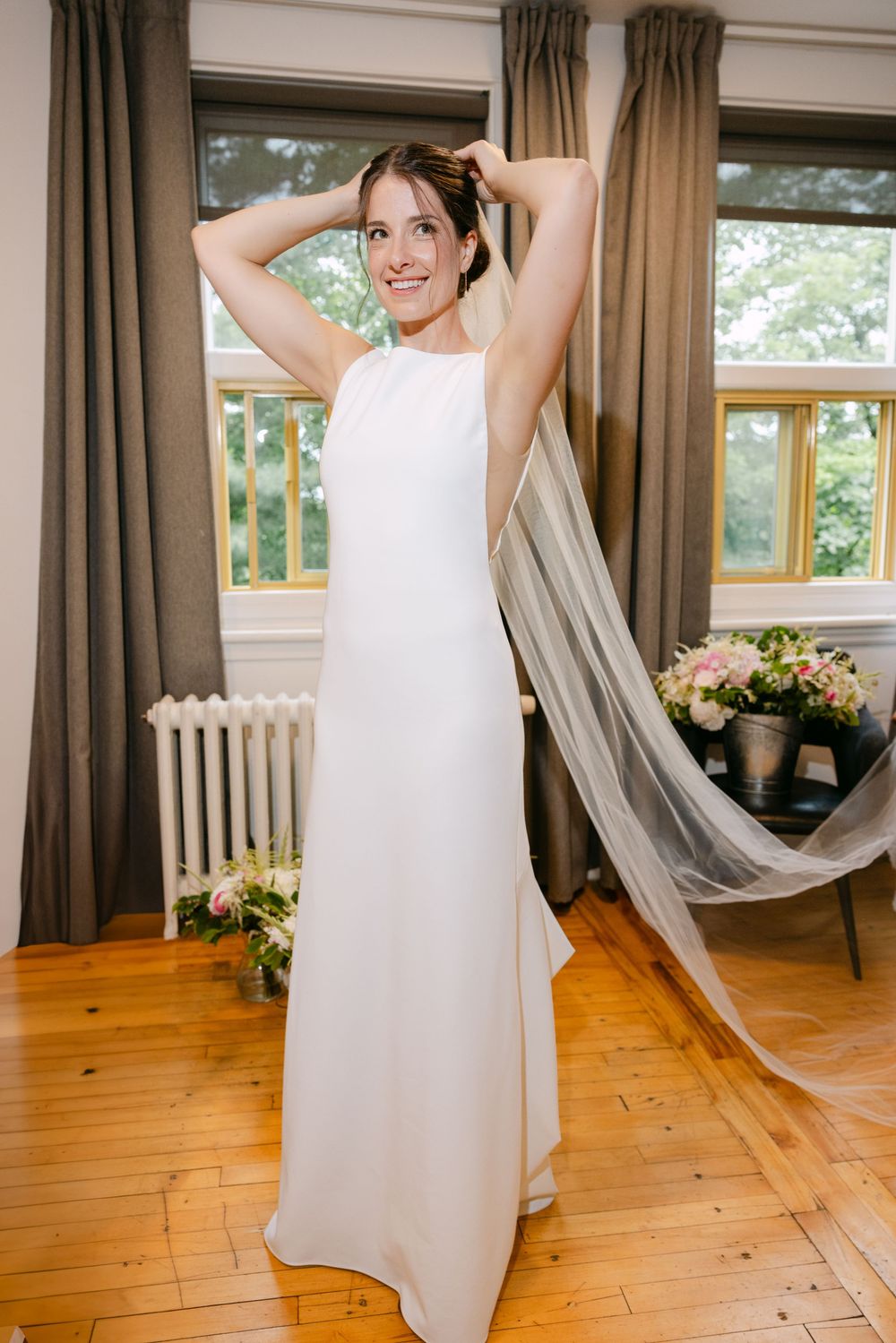 A sequence of photographs showing someone in a flowing white wedding dress dancing and twirling in a sunlit room.