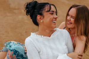 Elegant and natural couple portraits on Barceloneta Beach in the morning