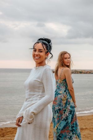 Elegant and natural couple portraits on Barceloneta Beach in the morning