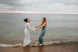 Elegant and natural couple portraits on Barceloneta Beach in the morning