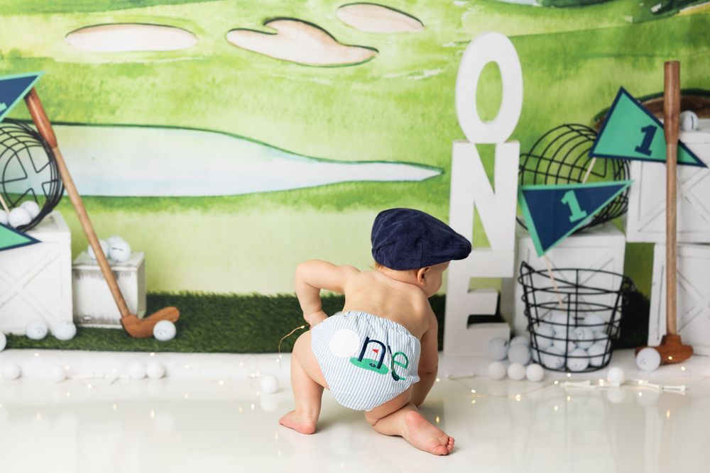 A green watercolor painted banner or background with white text and design elements.