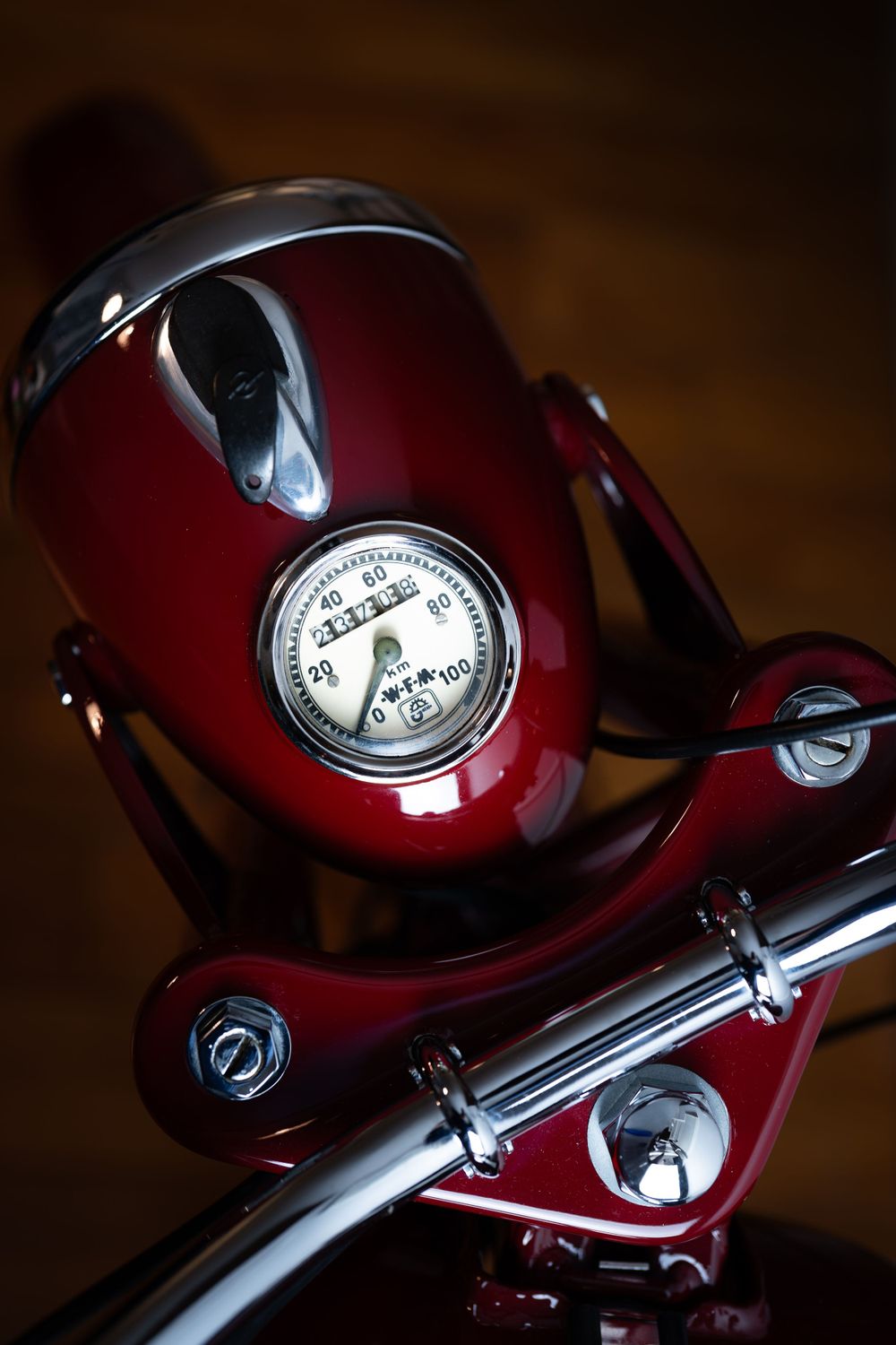 Professional close-up shot of a motorcycle’s headlight and handlebars, highlighting details for branding, catalogs, or product marketing.