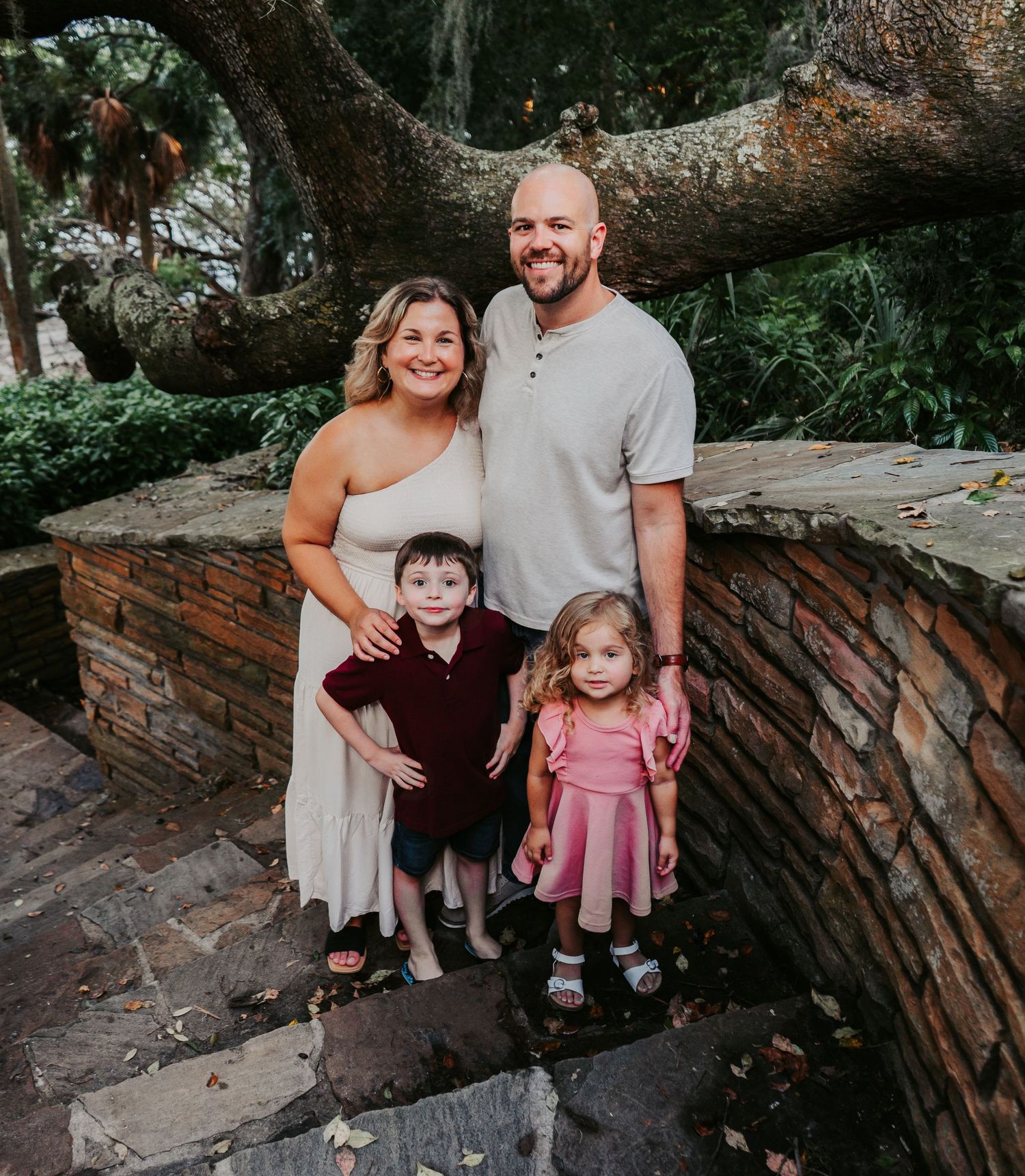 Outdoor Family Session Philippe Park in Safety Harbor, FL; Family posing on stone stairs