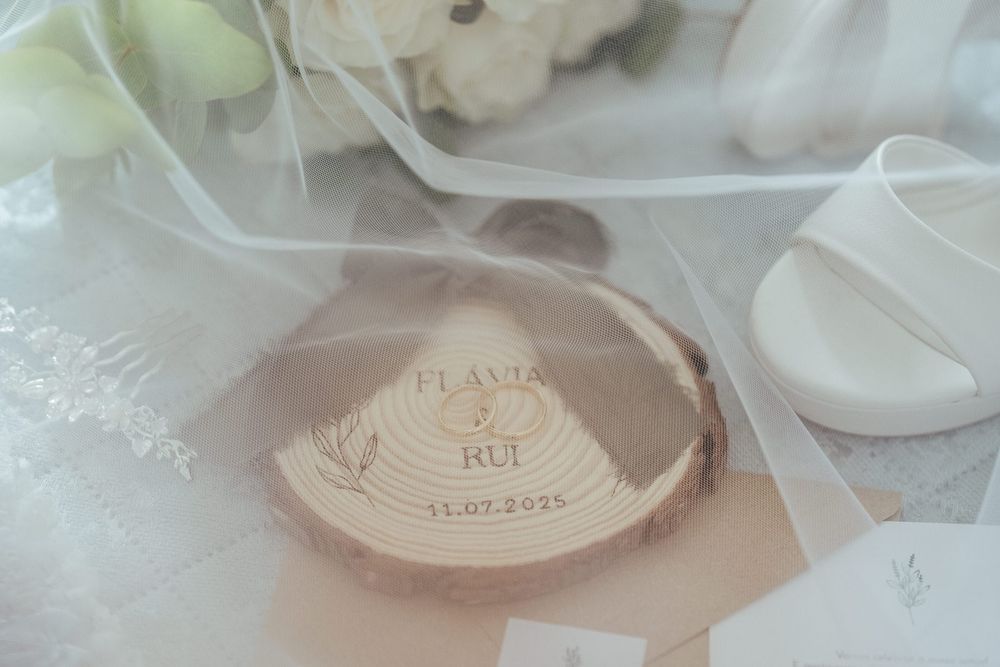 Rustic wooden slice wedding keepsake engraved with couple names Flavia and Rui and date 11.02.2021.