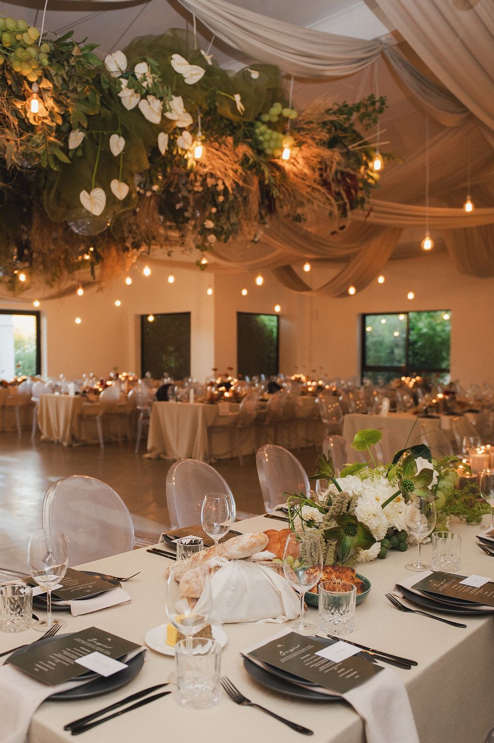 Luxury wedding reception styling with timeless floral arrangements and ambient lighting