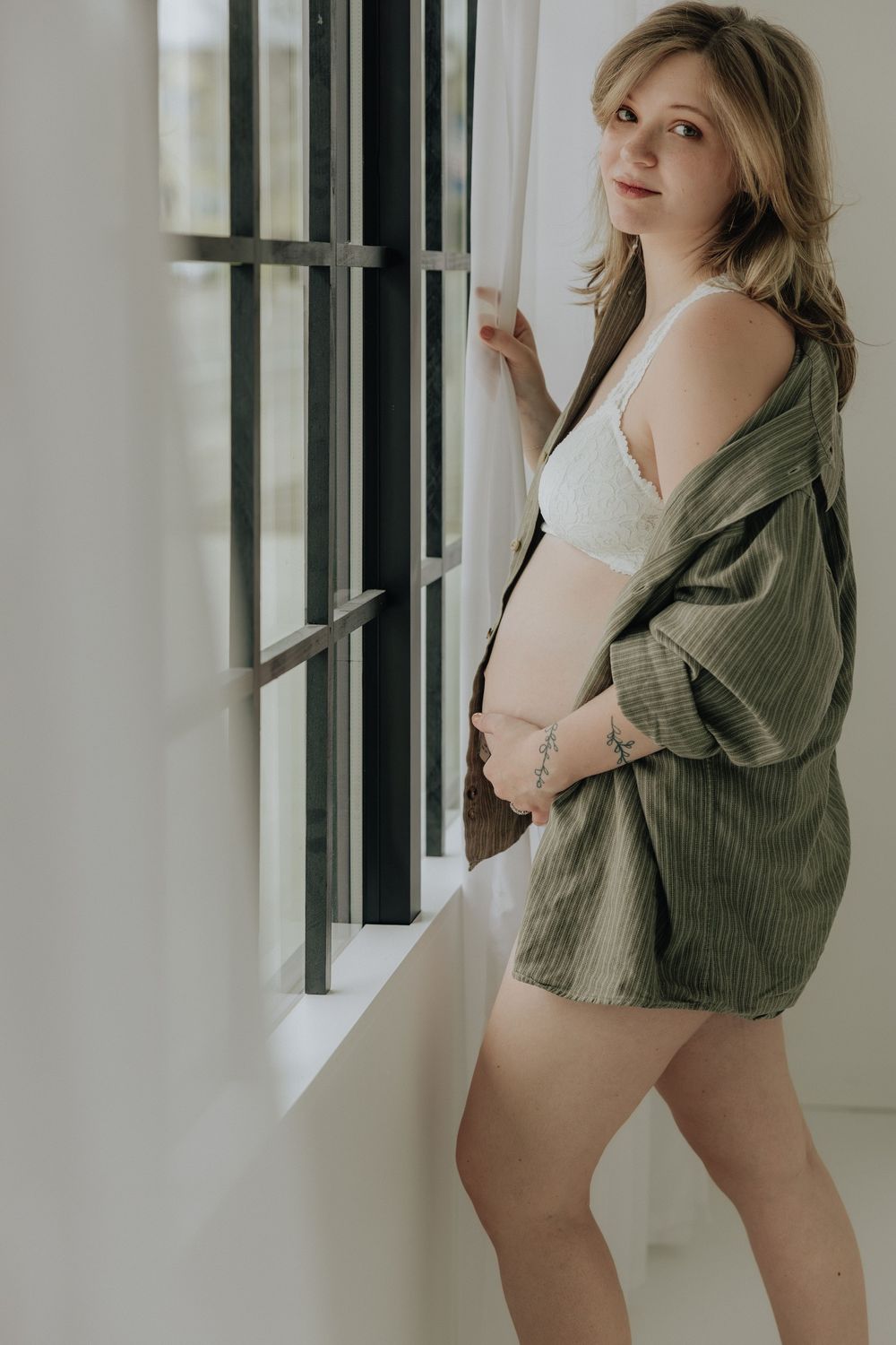 Rochester maternity photographer documenting calm and intimate pregnancy moments