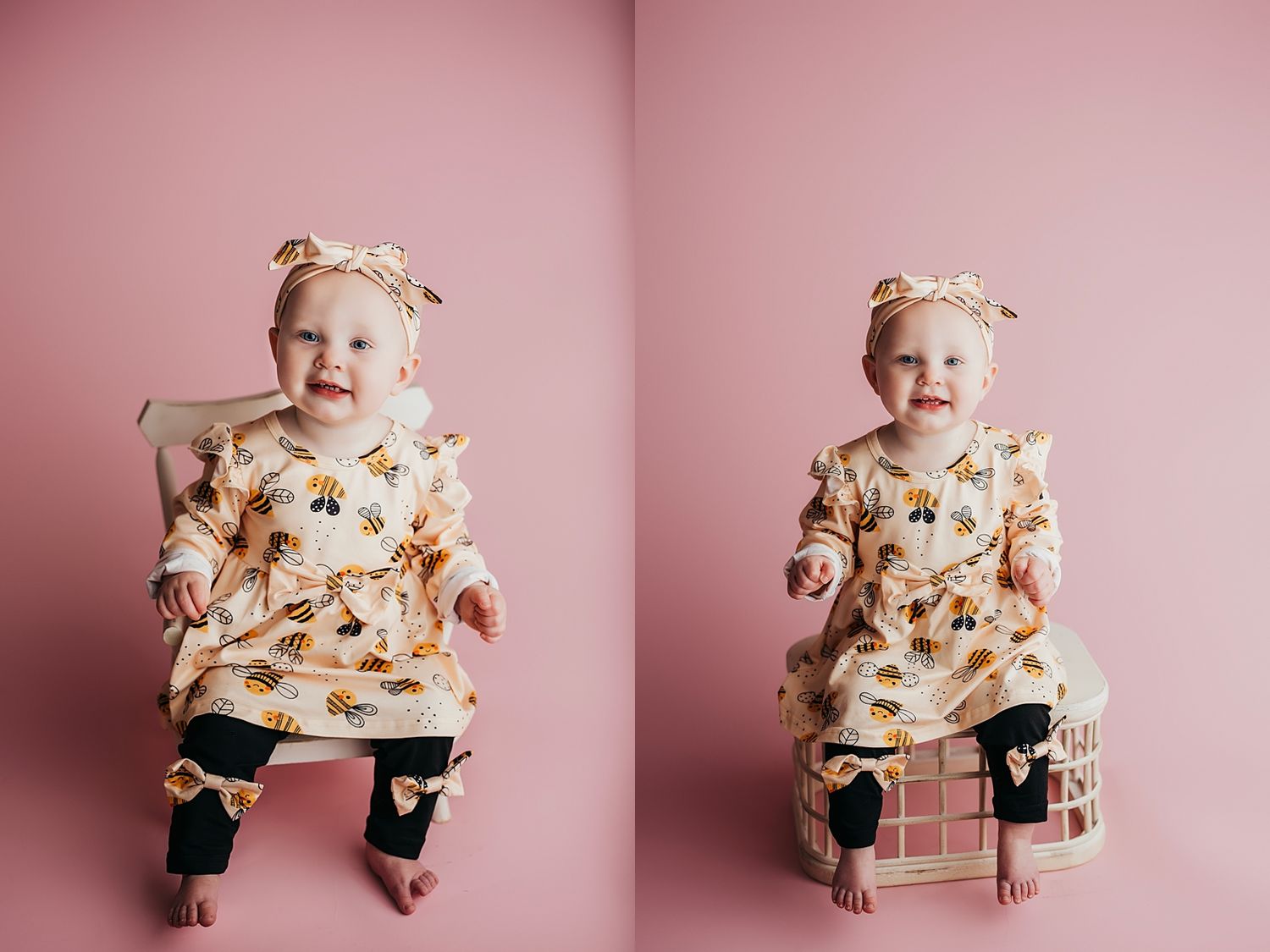 Smiling baby girl in floral dress and bow headband sitting on pink background in a professional portrait.