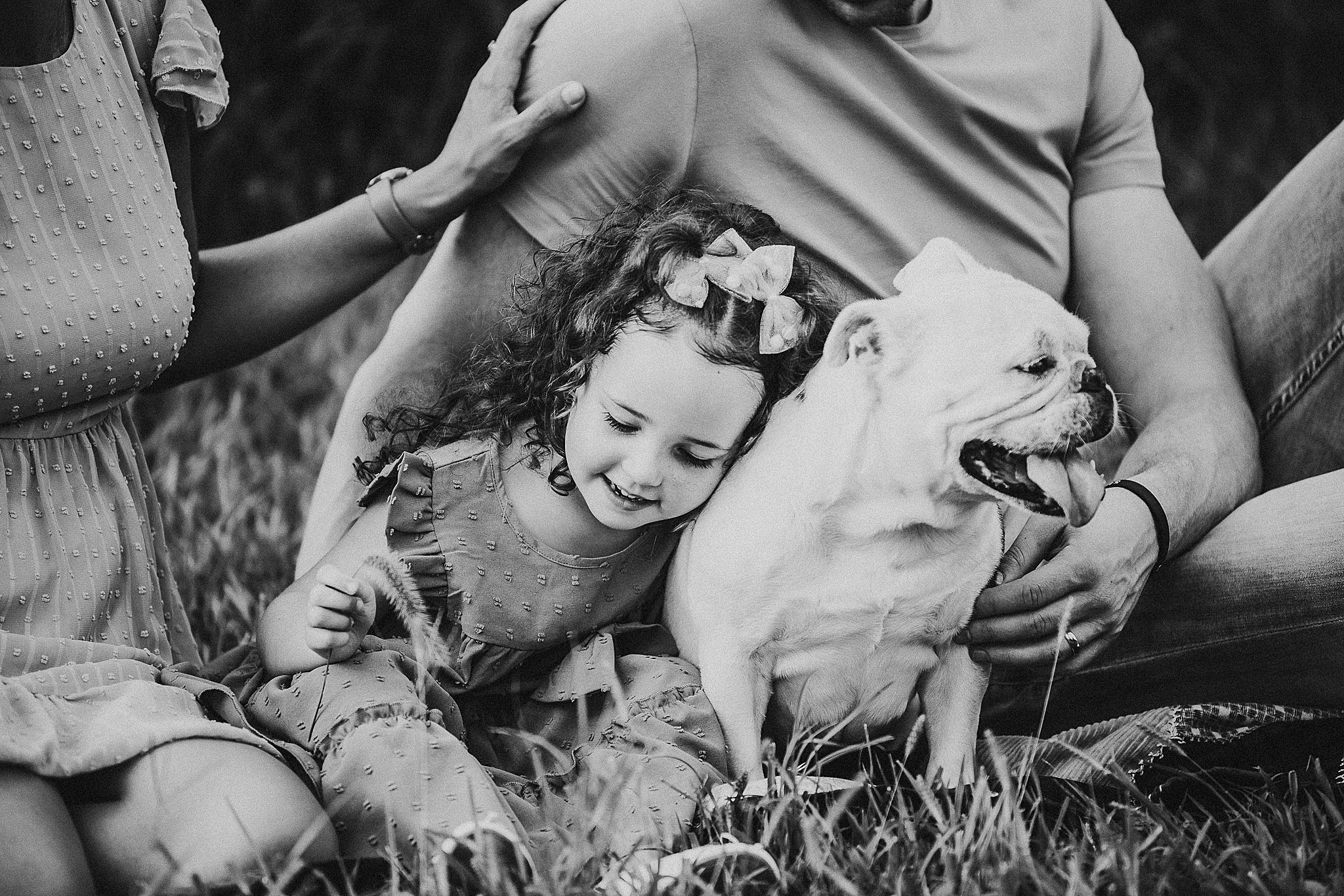 A series of black and white photos showing barefeet in grass and someone connecting with nature.