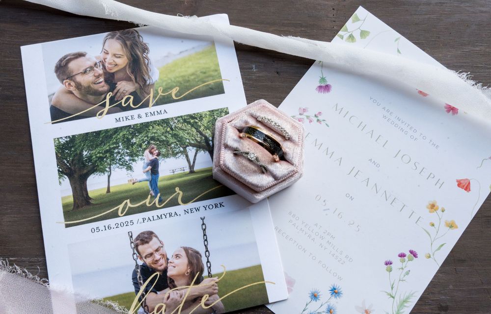 A collection of romantic engagement or wedding photos and cards scattered on a dark wooden surface.