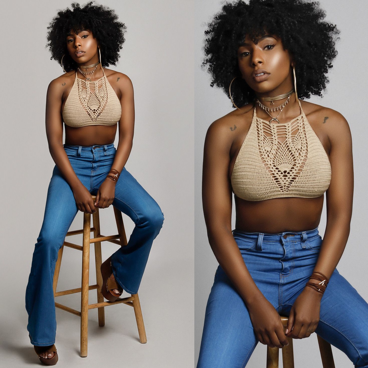 Fashion model in beige crochet crop top and high-waisted blue jeans poses on wooden stool against white backdrop.