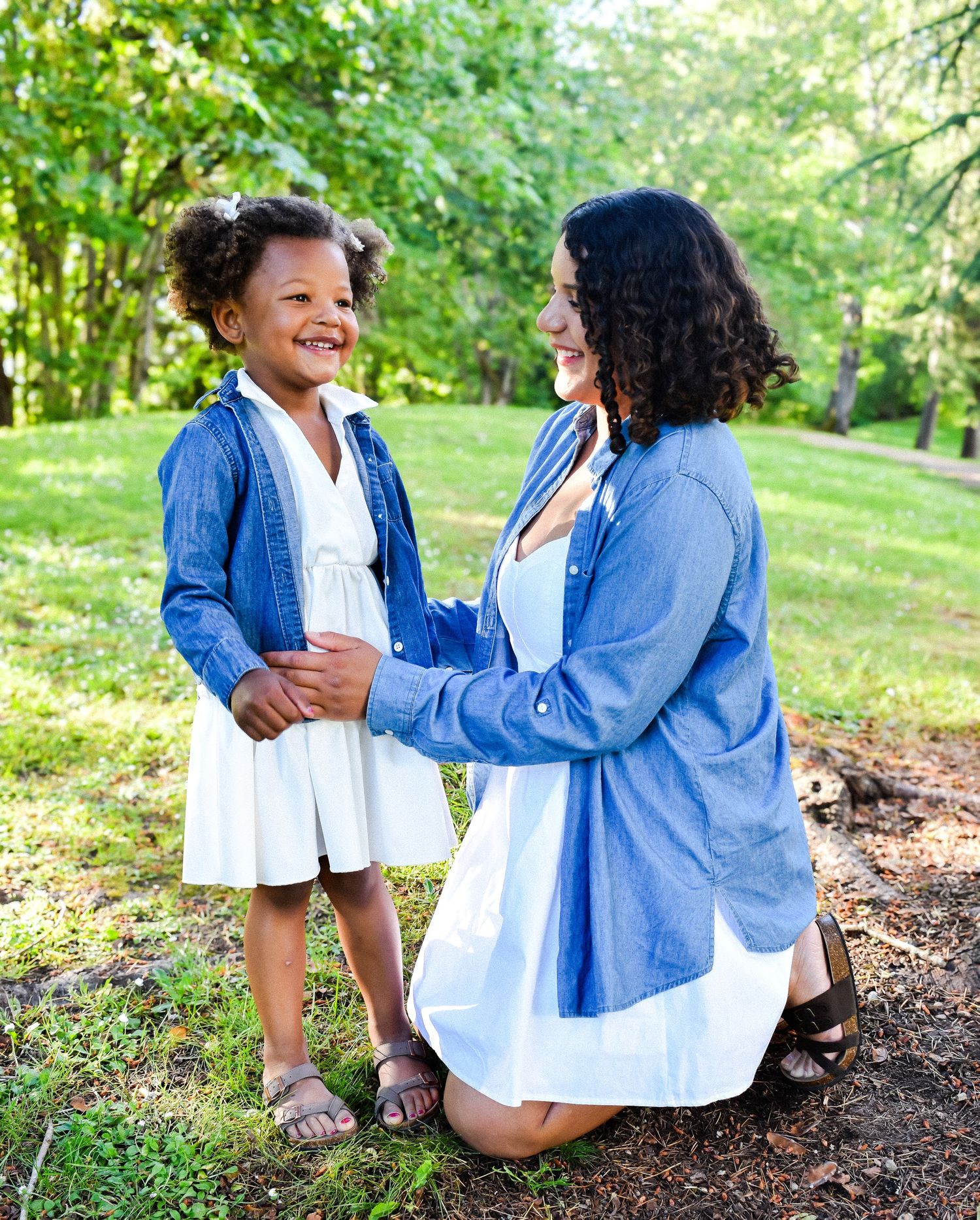 Mother and daughter laughing together during outdoor family portraits in Seattle