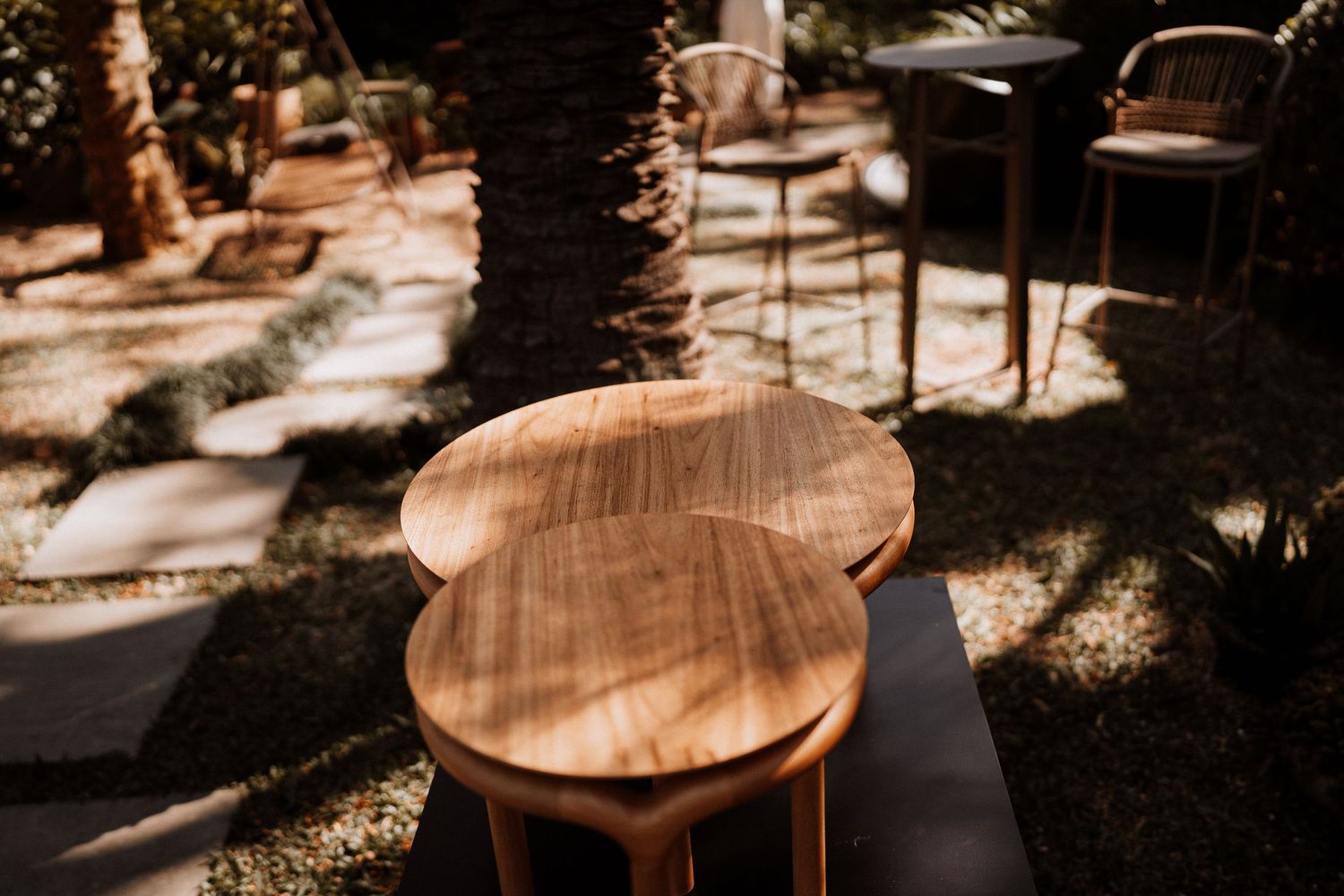 Wooden furniture details in warm sunlight showing minimalist Scandinavian design elements.