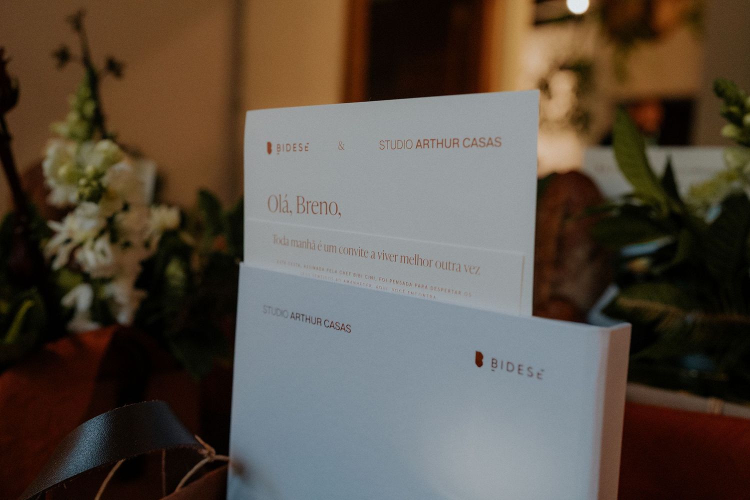 White business documents displayed on dark wooden surface.