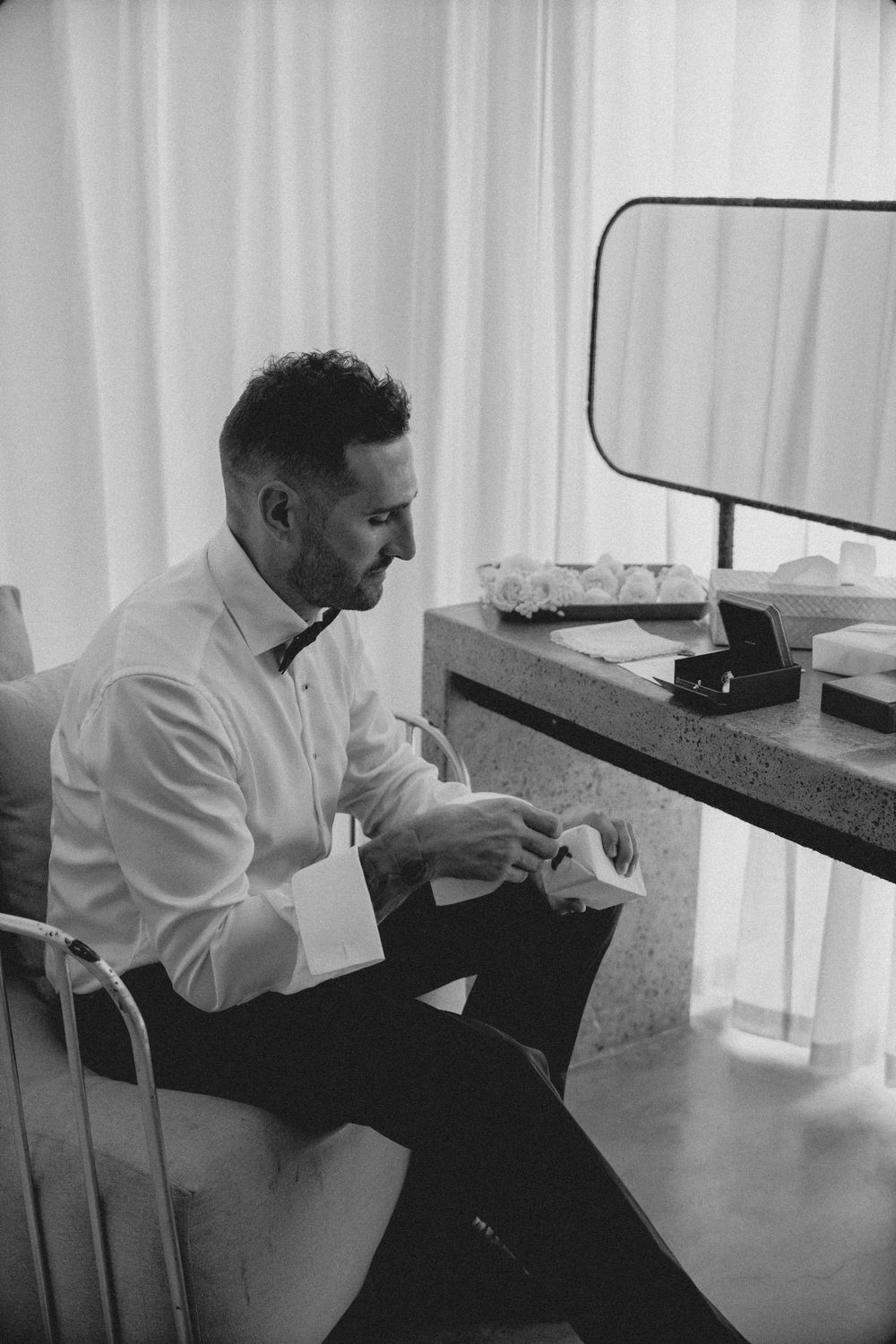 A person in a white shirt sits at a desk in a modern office space in a series of sequential photos.