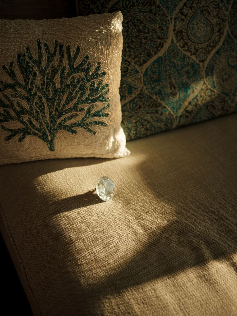 Artistic black and white photography of light and shadow patterns on a textured surface.