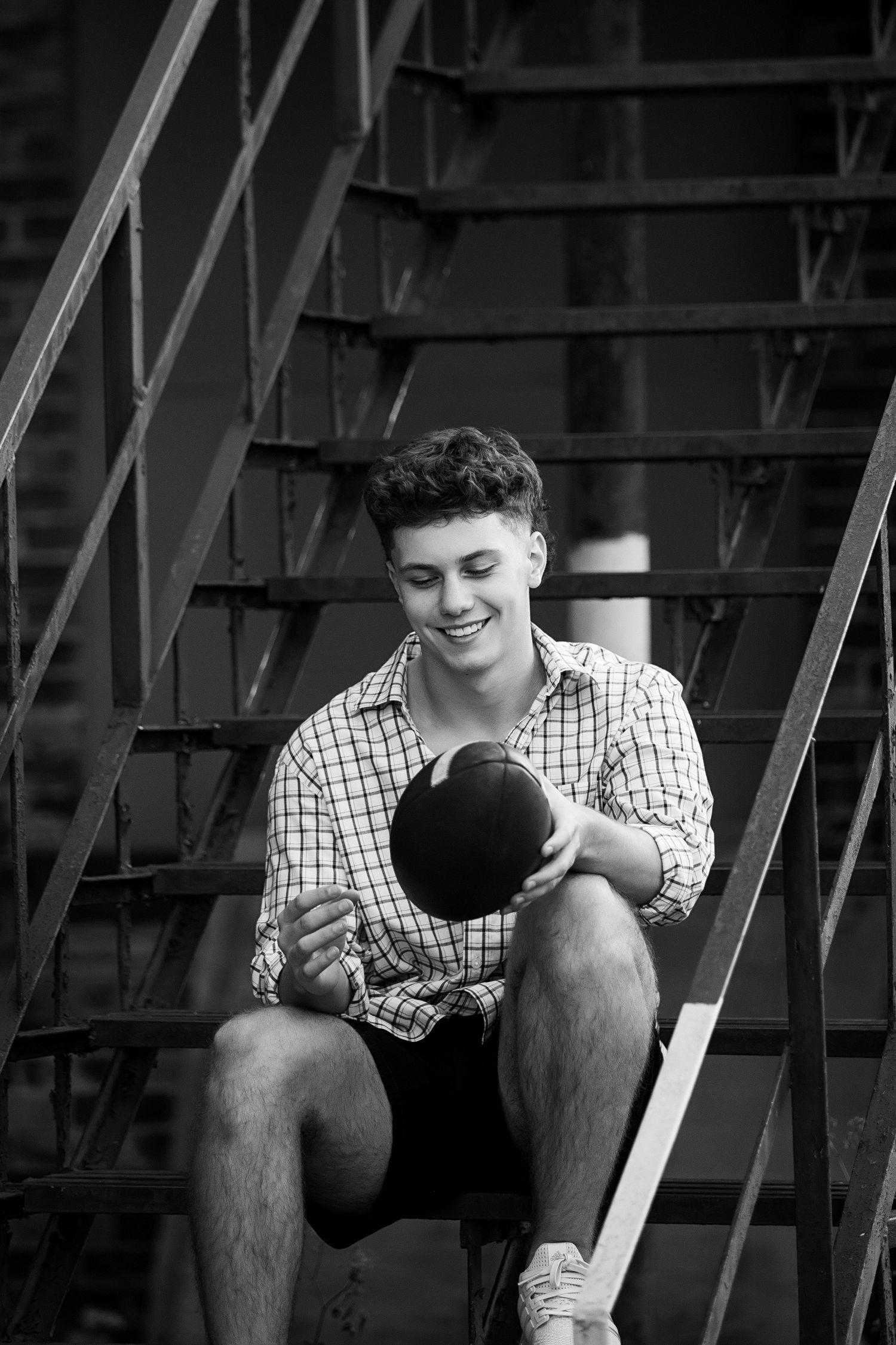 A series of black and white photos shows someone sitting on stairs in a checkered shirt looking downward.