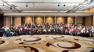 Panoramic view of an elegant ballroom with decorative ceiling and lighting fixtures.