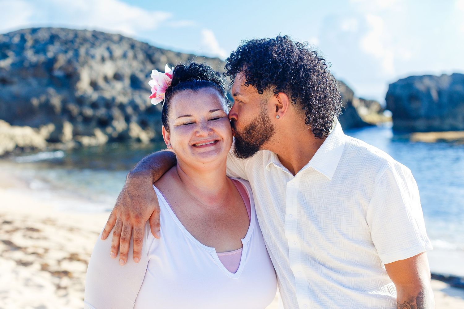 Family portrait on the beach. Mother and son. Playa Mar Chiquita, Puerto Rico.