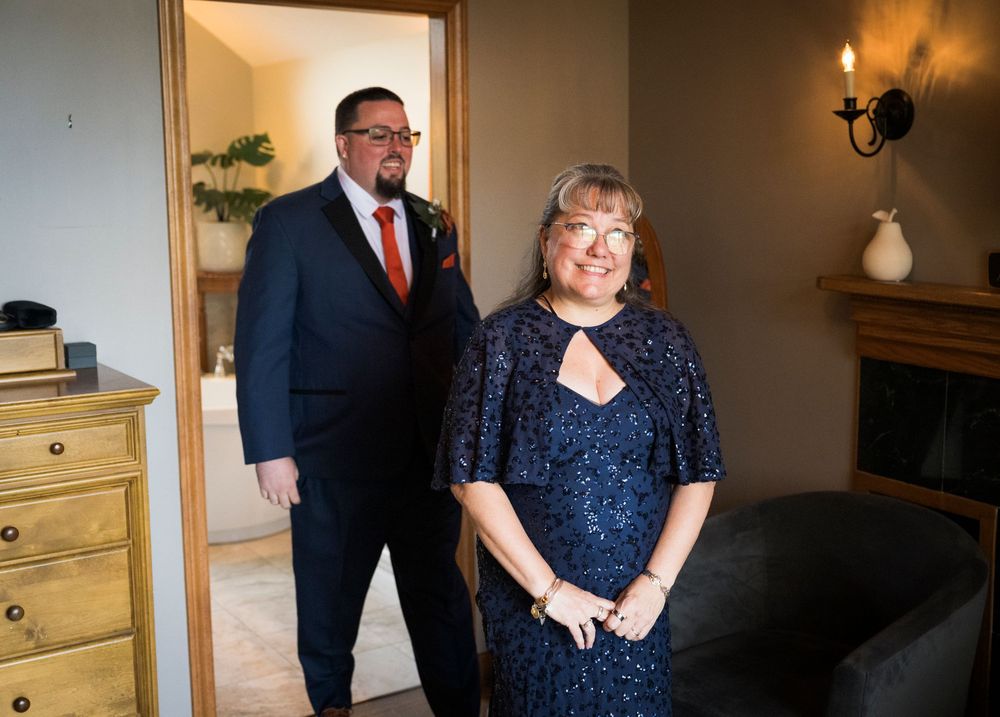 Wedding preparation moments in an elegantly furnished room.