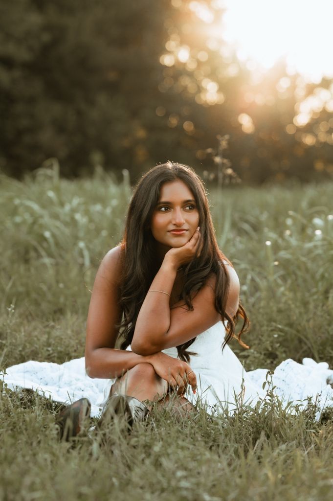 A dreamy outdoor portrait session in a wildflower meadow at golden hour.