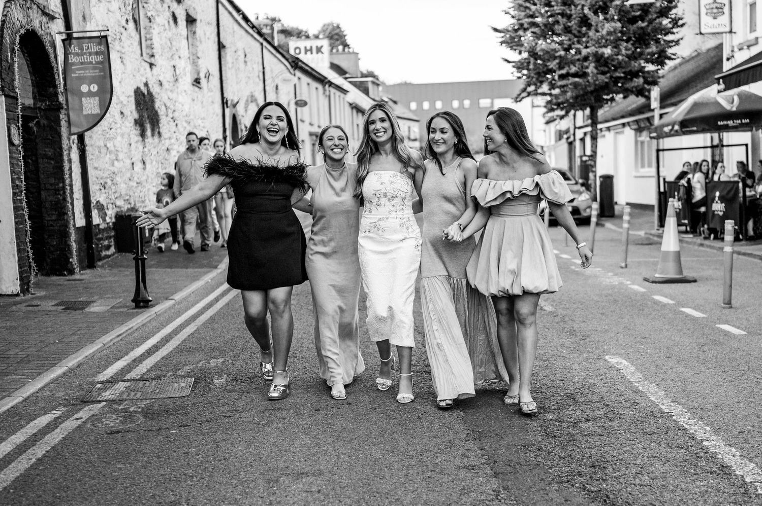 eleanor barry photography newborn waterford munster maternity kinsale co.cork girls walkling down street laughing smiling black and white