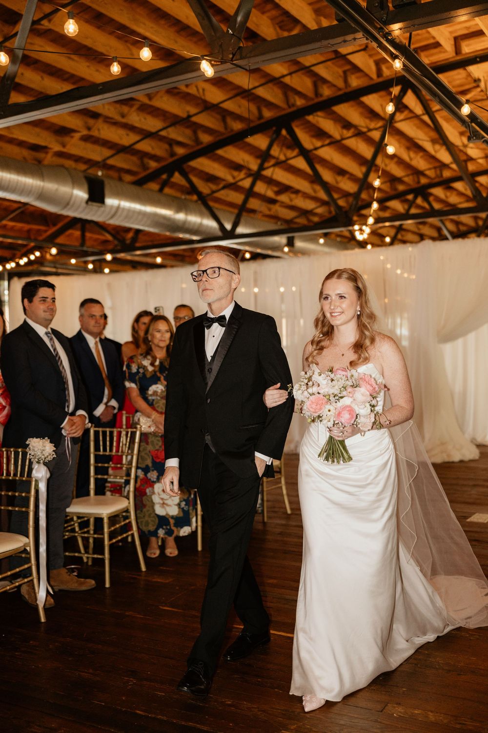 Bride and father walking down the wedding aisle at the iconic Georgia wedding venue Summerour Studio