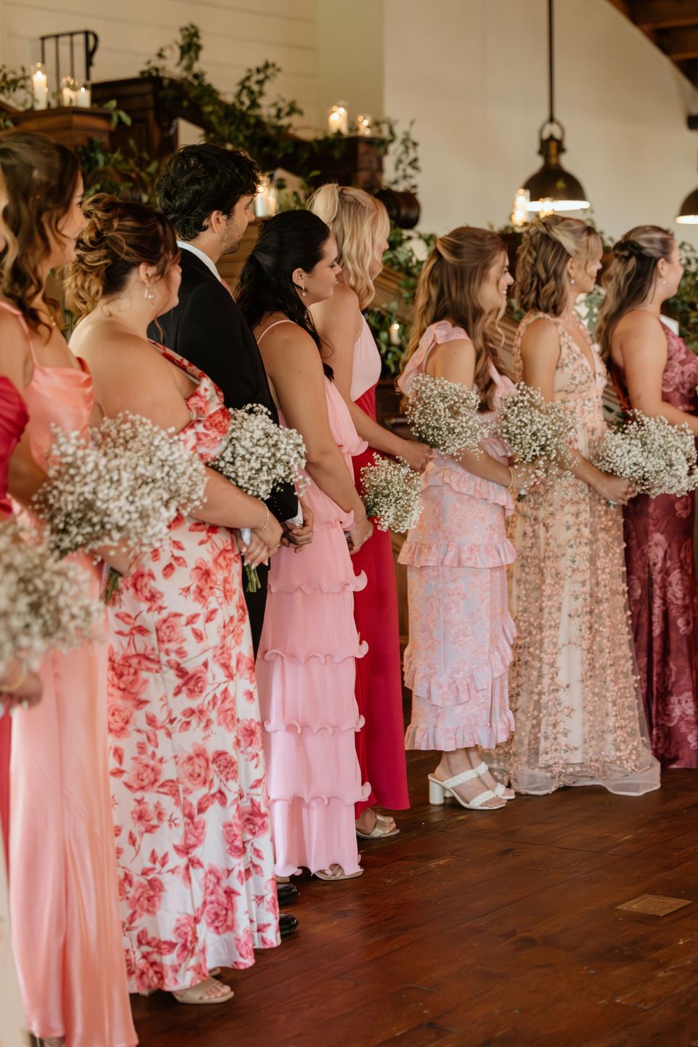 Bridesmaids are lined up during a wedding ceremony at Summerour Studio, an Atlanta wedding venue
