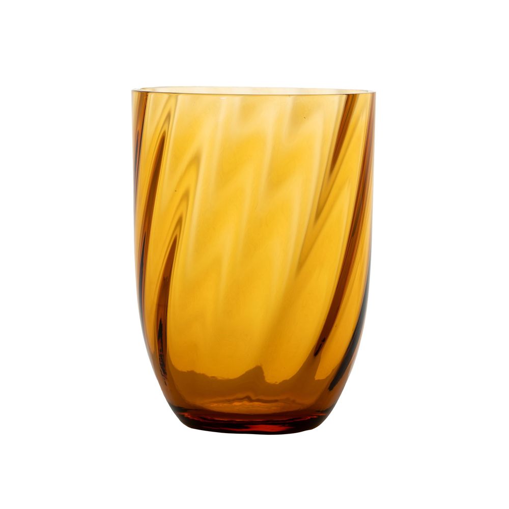 Product photography of an amber glass tumbler on a white background