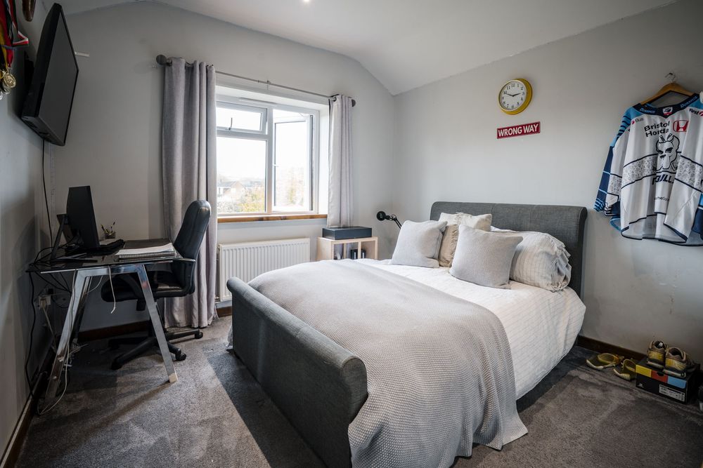 Property and interiors photography of a modern bedroom with workspace