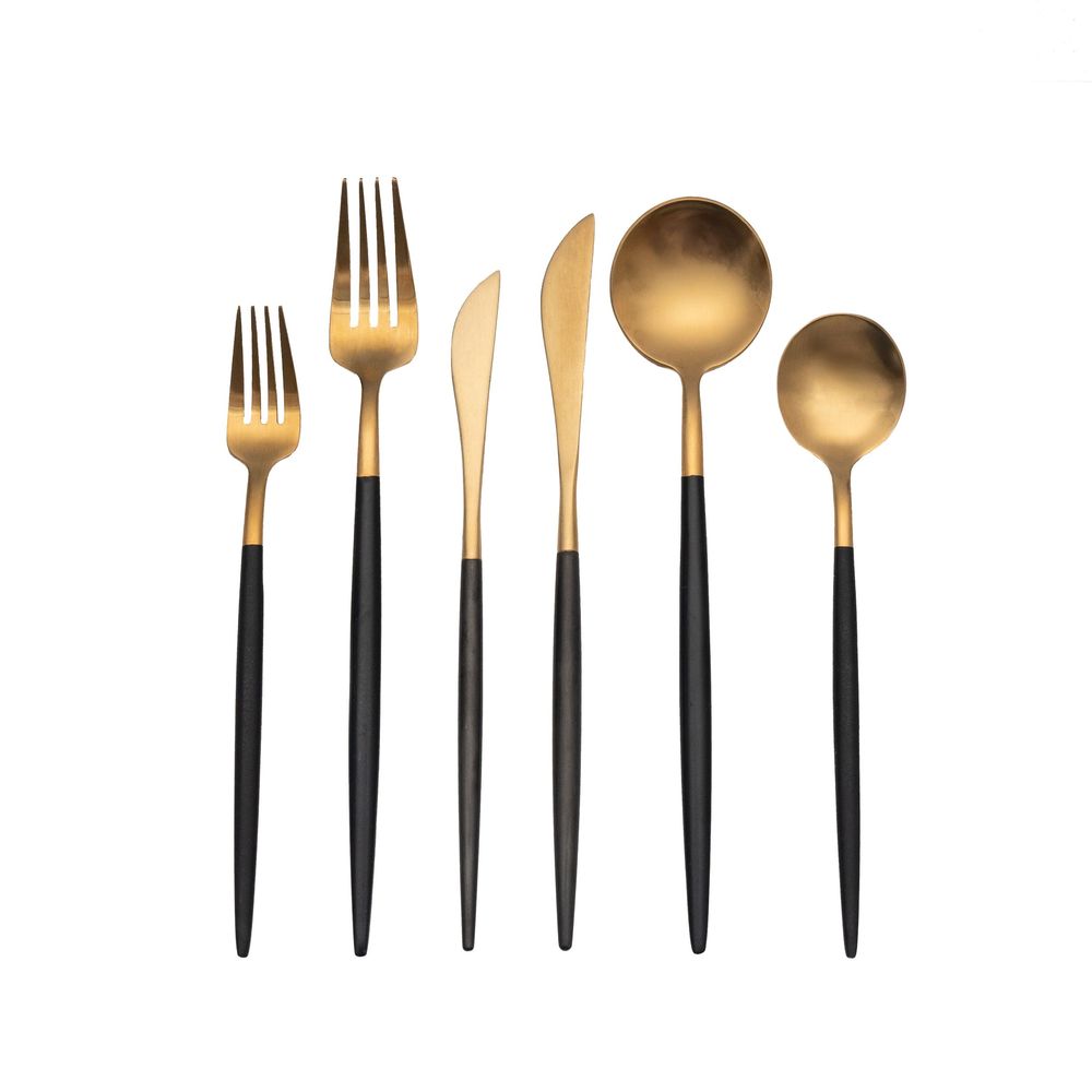 Product photography of luxury gold and black cutlery set on a white background