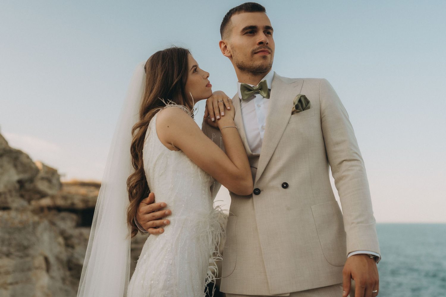Elegant coastal wedding photography with soft natural lighting and ocean views.