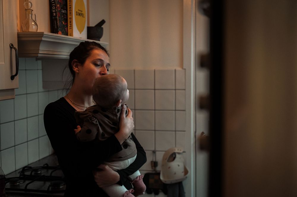 A series of five photos showing someone drinking coffee in a tiled kitchen setting.