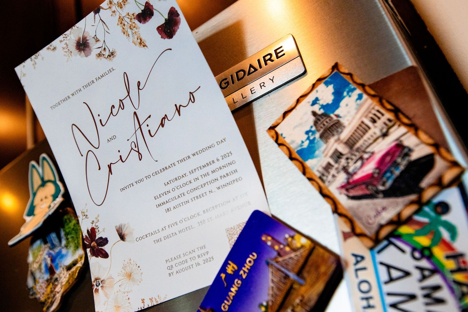 Wedding invitation cards and stationery displayed with elegant calligraphy and floral designs in warm lighting.