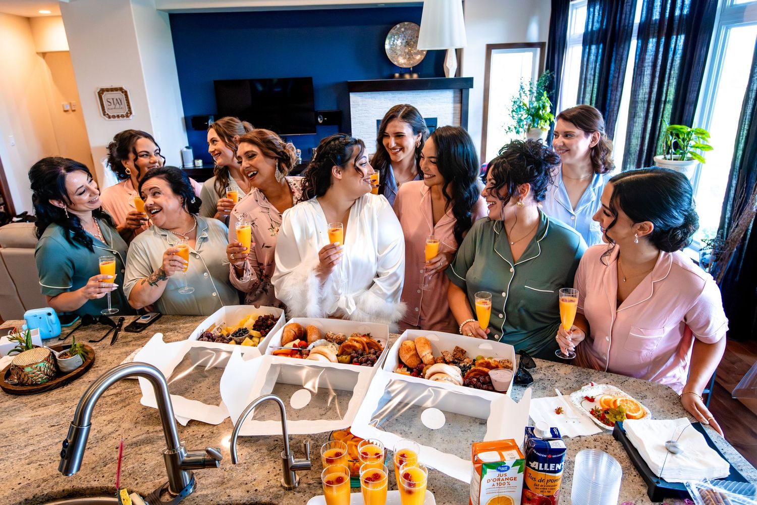 Group of people gathered around a table for a casual dining experience in a warm, inviting setting.